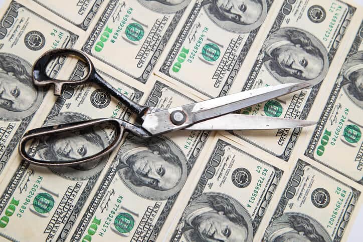 scissors cut dollars