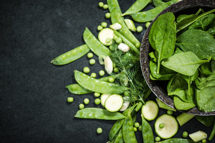 clean eating and healthy diet green vegetables on dark slate